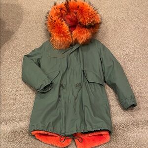 Italian designed green coat with orange removable lining and fur collar.